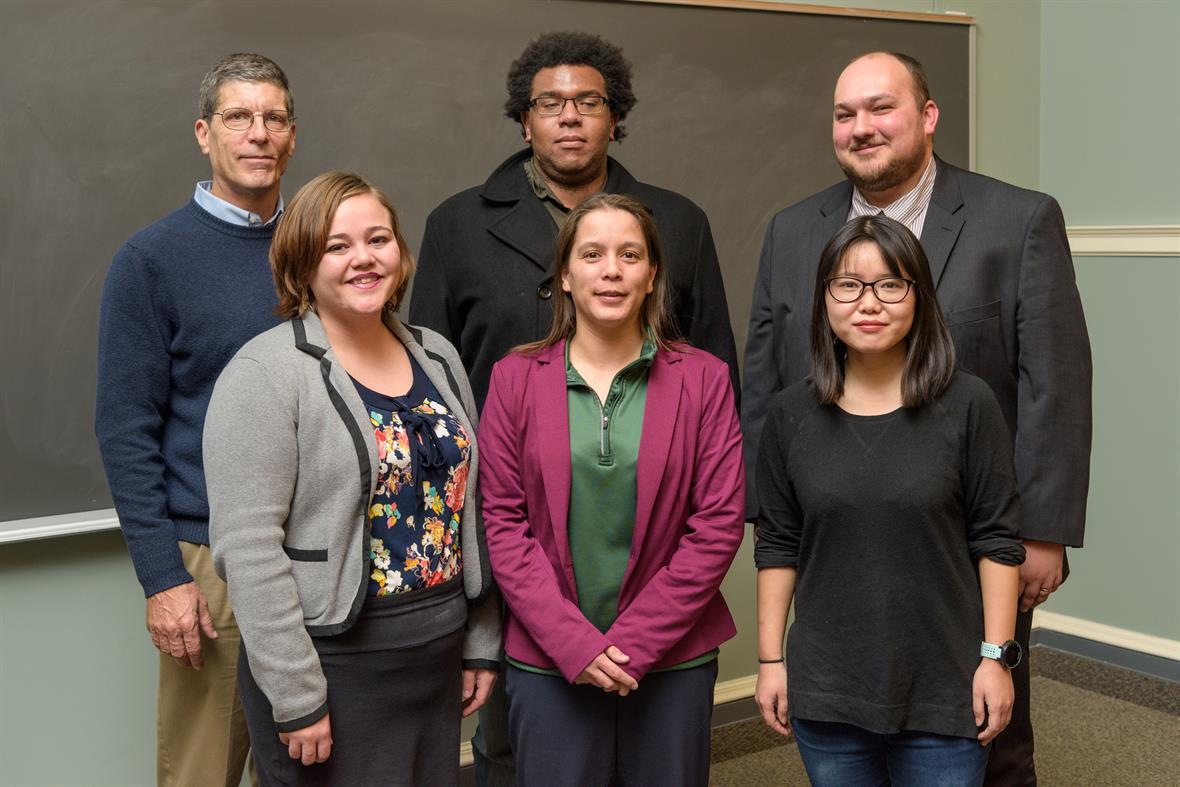 Winter Research Symposium graduate student participants pictured with Dr. Braun (top left) and Dr. Liaw (bottom center)